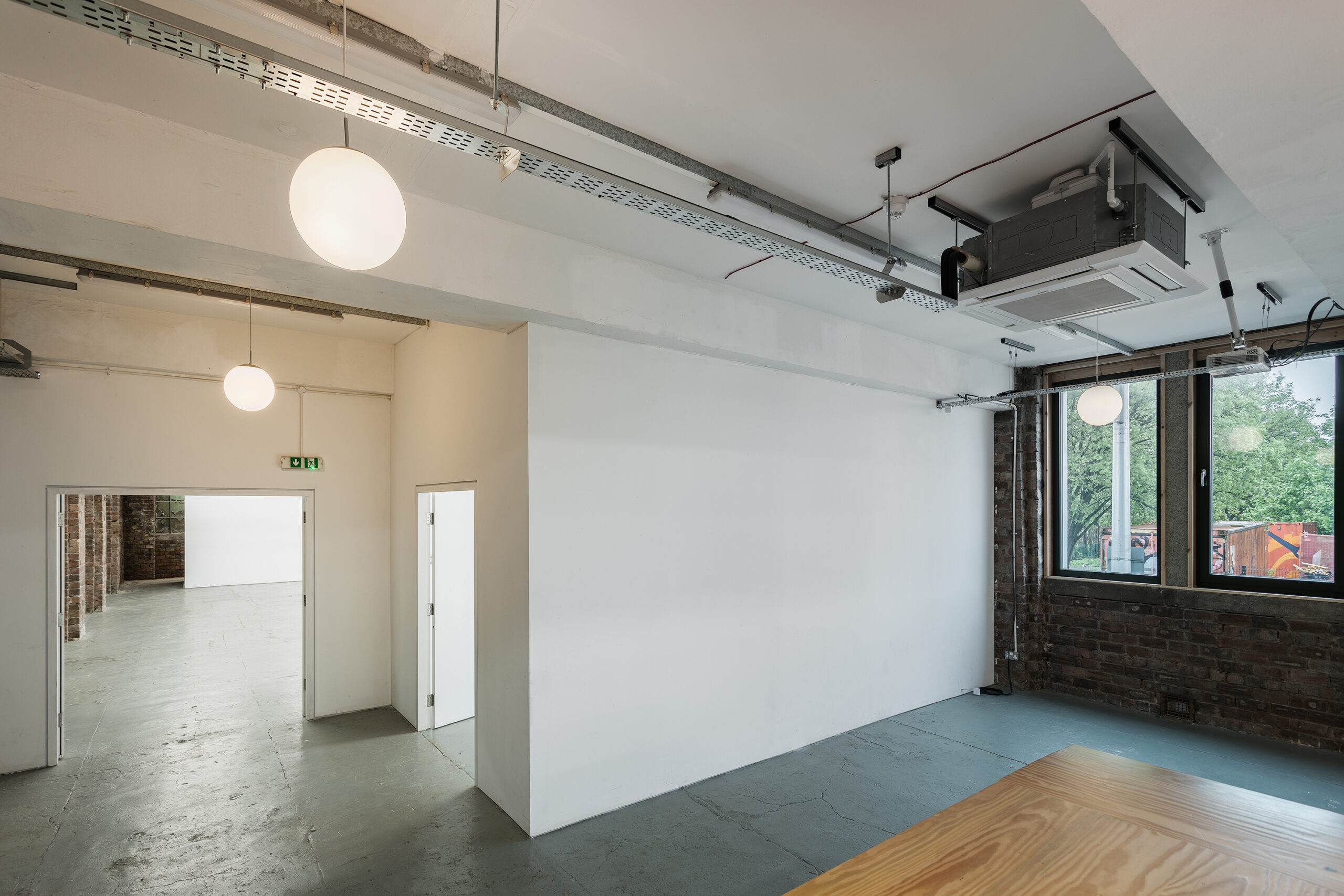 Photo of the project space at Civic House. This can be used as the ticket booth and check-in desk for the Festival hub as it is a small white box placed conveniently between the venue and the canteen.